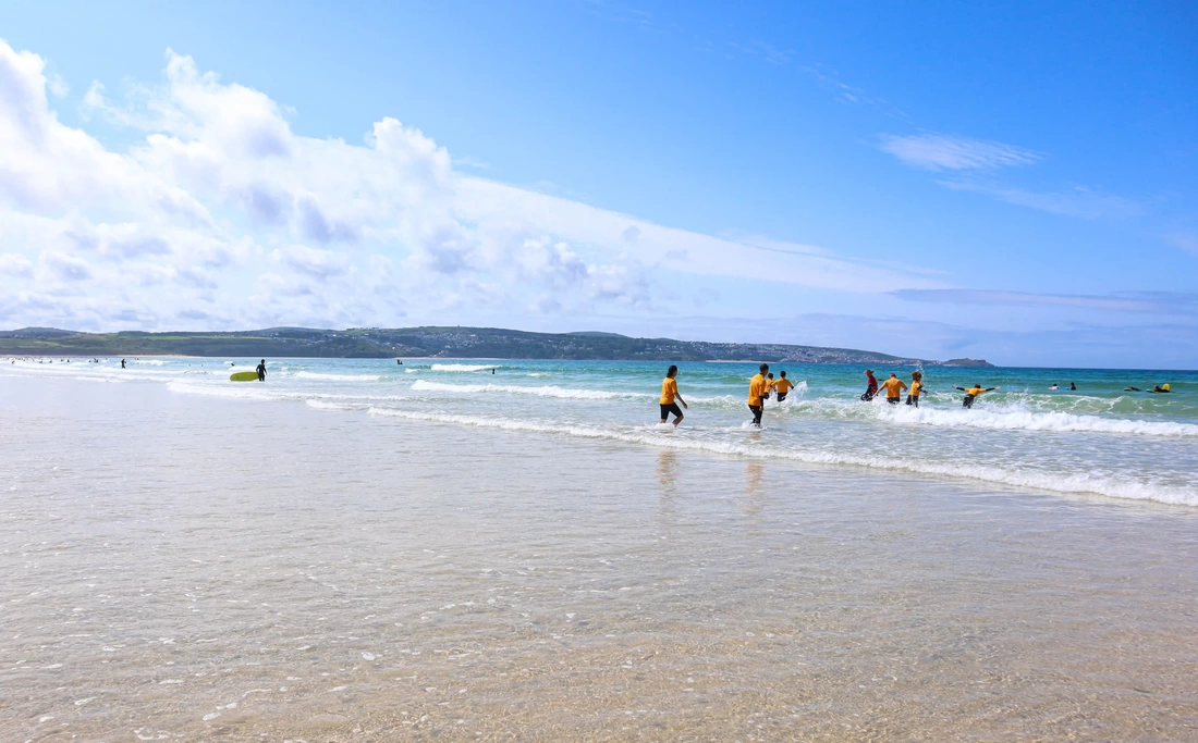 surf lesson at three mile beach in Cornwall