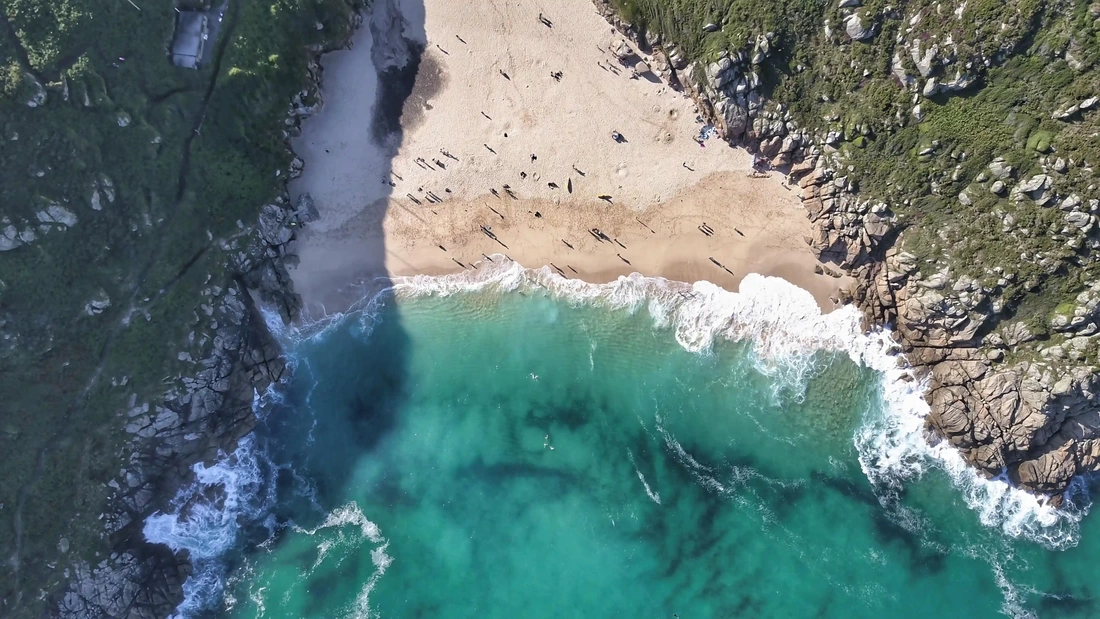 aerial drone view of Porthcurno Beach in Cornwall 
